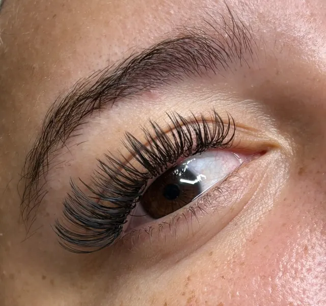 Wet set lash extensions with a spiky, glossy texture